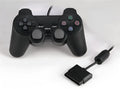 PS2 wired USB game controller with vibration feedback in neutral bare metal finish