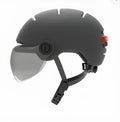 Cycling helmet with integrated LED brake and tail light system on adult head