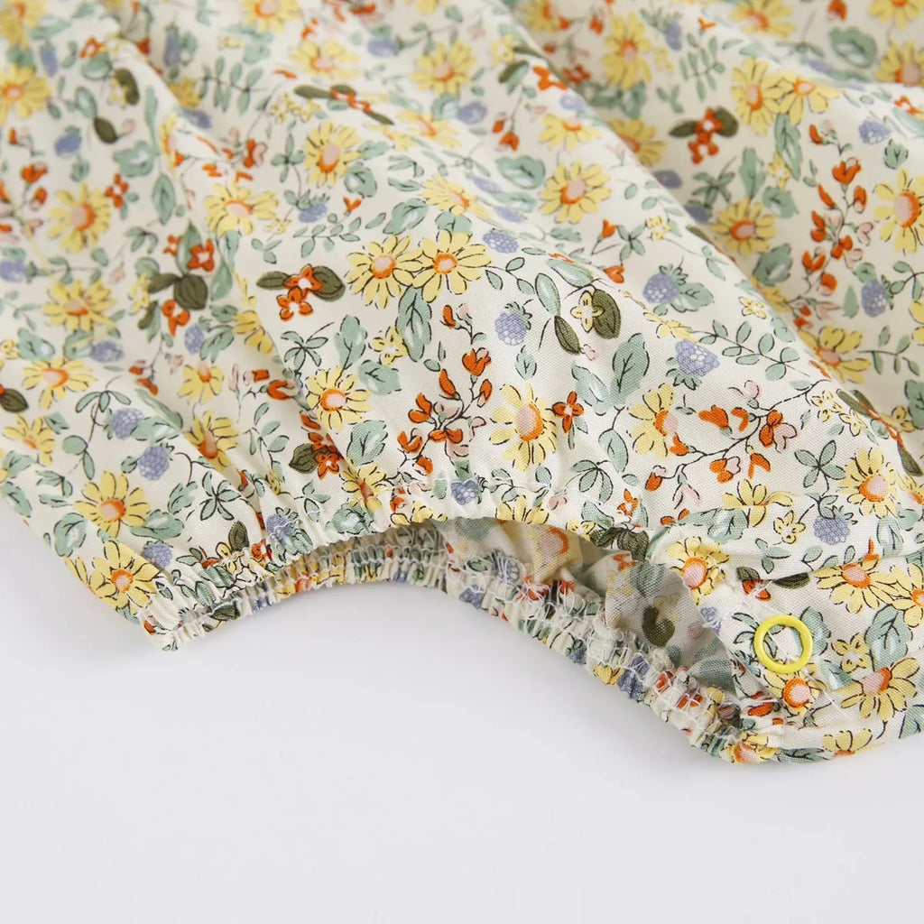 Yellow cotton floral baby romper with doll collar, triangle jumpsuit style for girls 0-6 months to 2-3 years