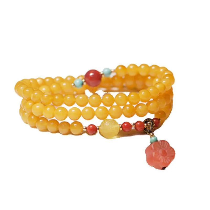 Yellow chicken grease beeswax design on 5mm amber bracelet with animal zodiac modelling