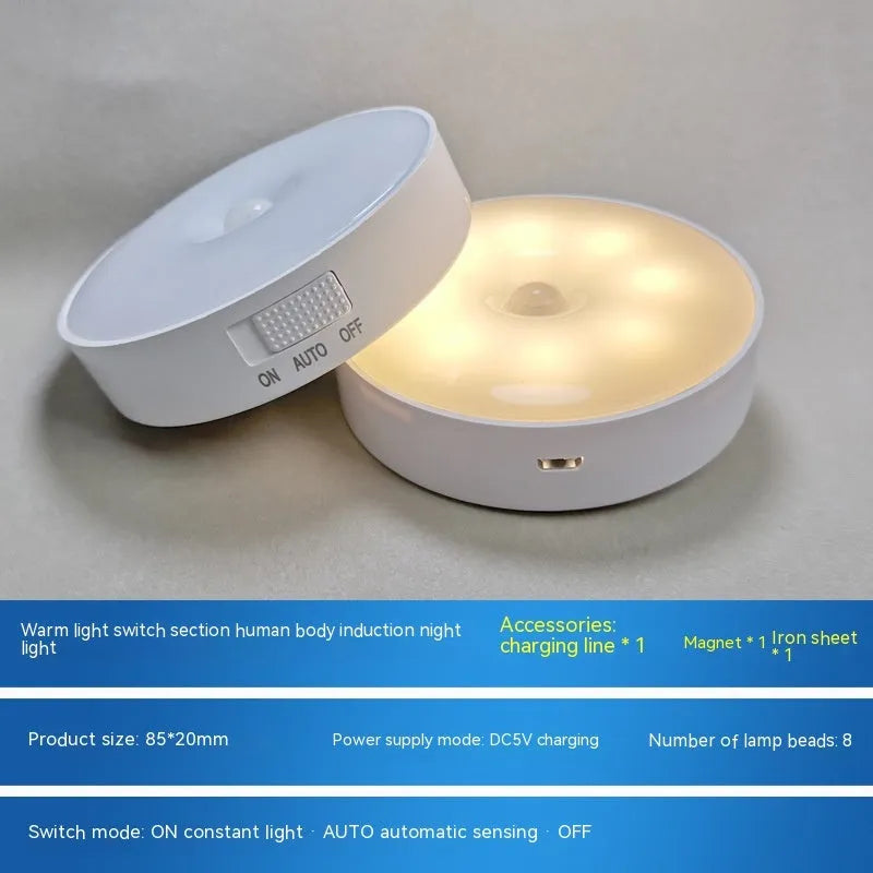 Compact round motion sensor LED night light in beige colour with USB charging cable
