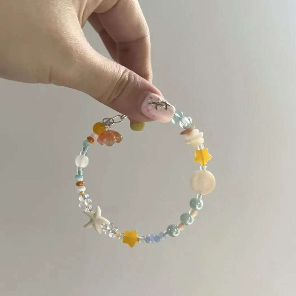 Orange sea summer bracelet with diamond shape design and round decorative elements