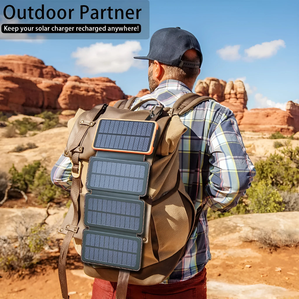 A black outdoor solar power bank with a solar panel, LED light, and soft leather finish, shown with a charging cable.