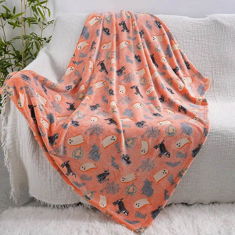 Cartoon-patterned flannel blanket for a child's bed, shown in one of five colour options.