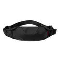 Black oxford cloth crossbody waist pack showing front zipper and strap.
