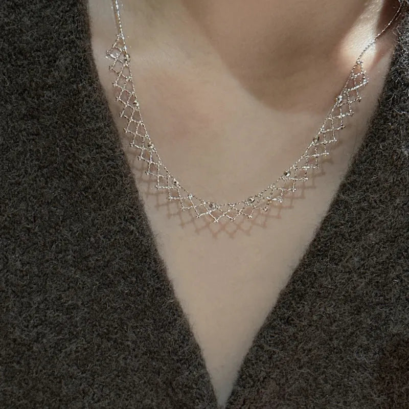 925 silver irregular geometric pendant necklace with electroplated finish on display
