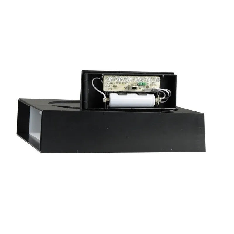 Solar powered illuminated house number light with white LEDs mounted on exterior wall