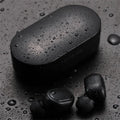 Black and white Bluetooth headphones with earbud design for wireless stereo sound