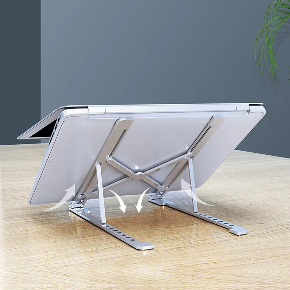 Silver aluminium laptop stand holding a MacBook, shown in both open and folded flat positions.