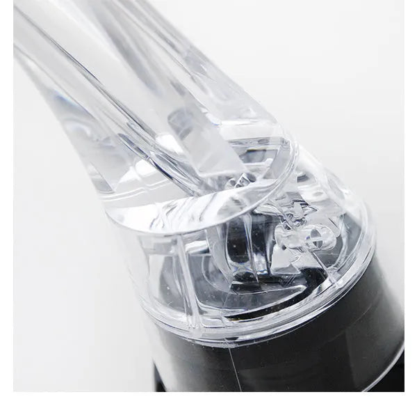 Compact clear acrylic wine aerator with a stainless steel filter inside, measuring 16cm.