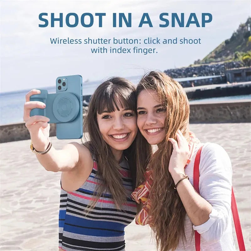 Black magnetic phone camera grip holder with rotatable bracket on a table.
