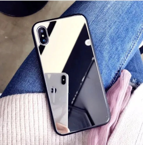 Black iPhone case with a reflective mirror surface on the back, compatible with multiple iPhone models.