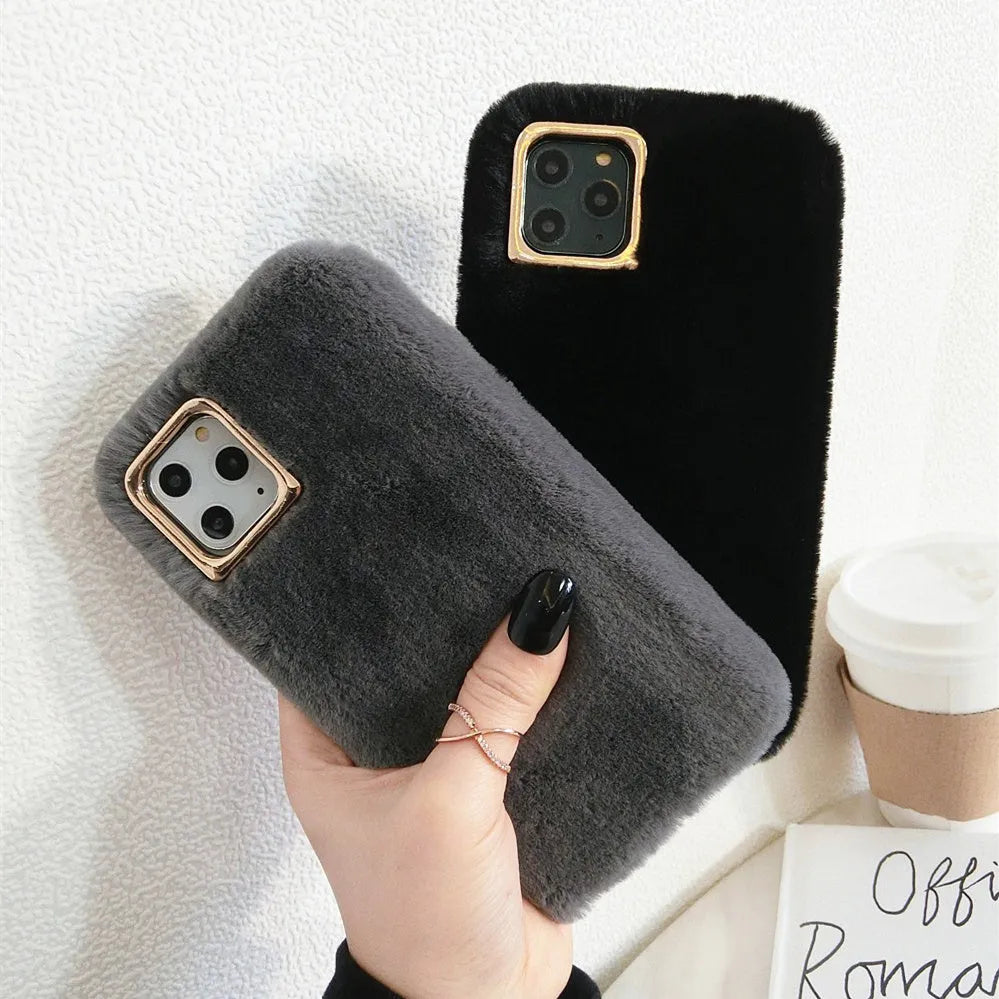 A pink rabbit plush phone case next to a silicone shell, showing the raised camera circle.