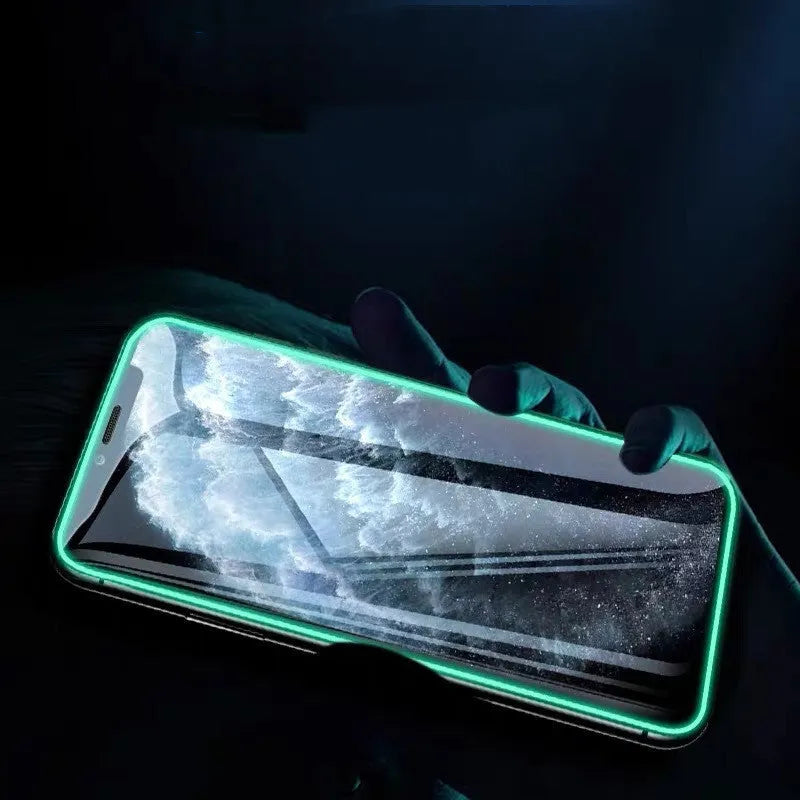 Luminous full cover tempered glass screen protector for iPhone glowing blue in the dark.