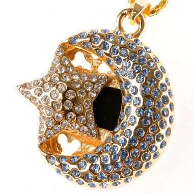 Creative metal jewellery-shaped USB flash drive on a keyring against a plain background.
