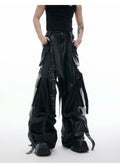 Black loose-fit quilted trousers with multiple pockets and PU leather composite fabric