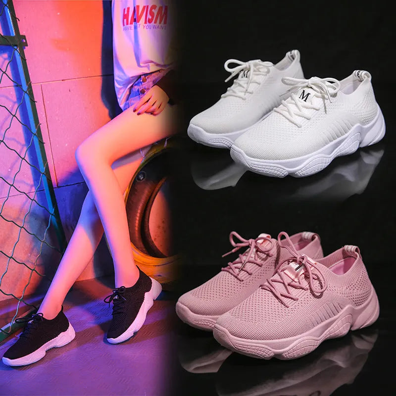White women's thick-soled casual trainers with woven upper and front strap closure
