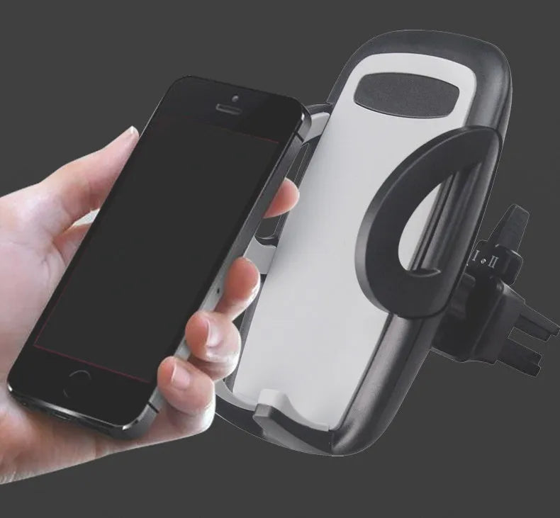 Black plastic mobile phone holder mounted on car air conditioning outlet vent
