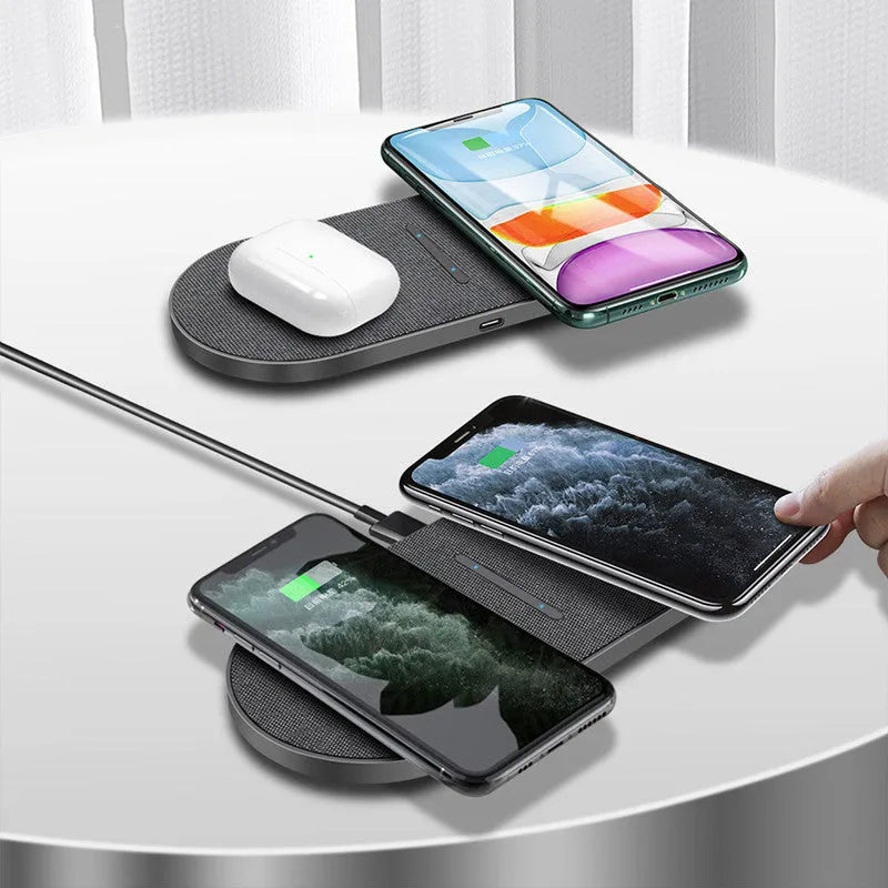 A pair of black 10W dual wireless charging stands on a desk.