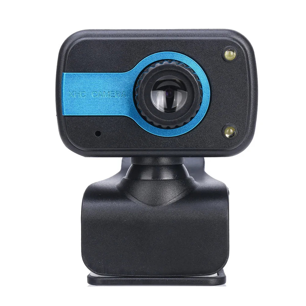 Blue mini USB webcam with a 360-degree rotating head on a desk next to a laptop.