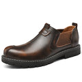 Men's black cowhide leather round toe loafers with rubber sole on a light background