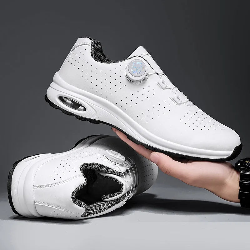 Men's black and white low-top mesh casual tennis shoes with lace-up front and cross straps.