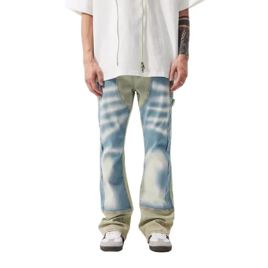 Yellow and blue retro patchwork splash-ink distressed design jeans on a mid-waist.