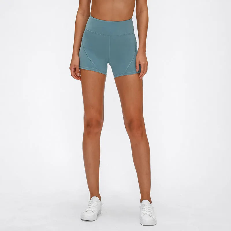 SHINBENE women's high waisted athletic shorts in black with two side pockets and cotton feel nylon spandex fabric