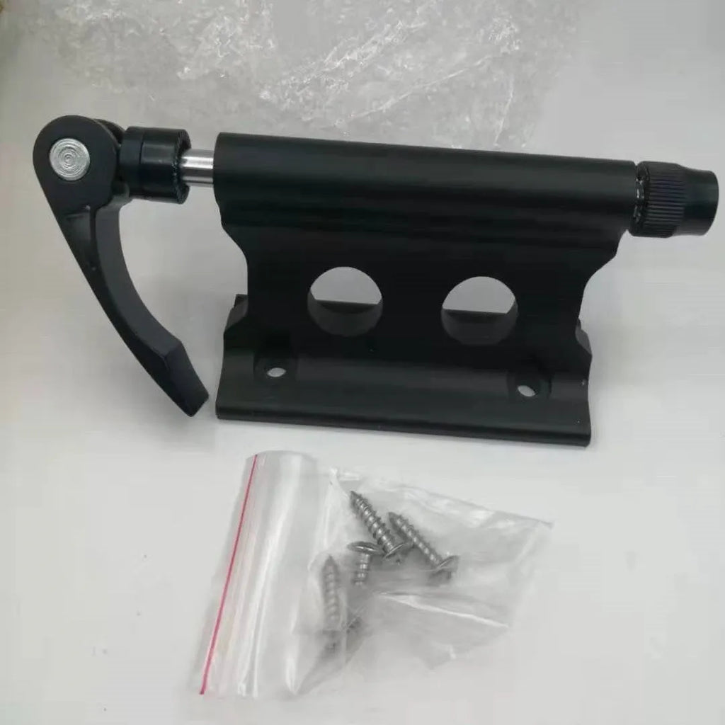 Silver metal quick-release clamp for securing a bicycle front fork during transport.