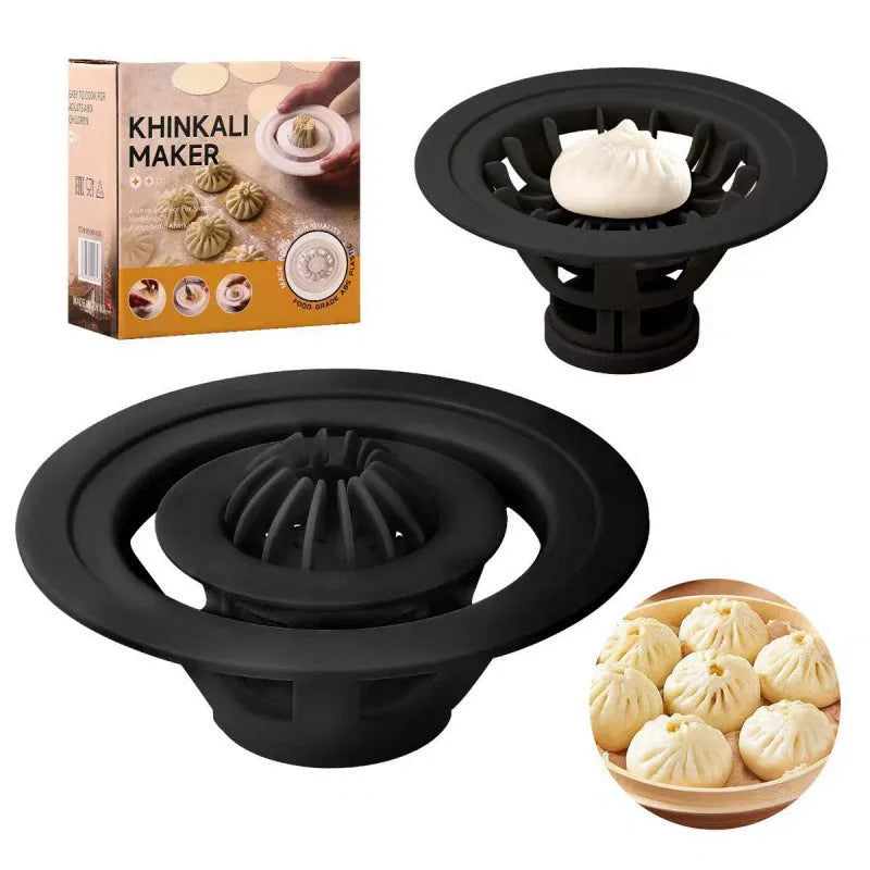 Set of four black stainless steel bun and dumpling moulds for shaping baozi.