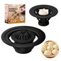 Set of four black stainless steel bun and dumpling moulds for shaping baozi.