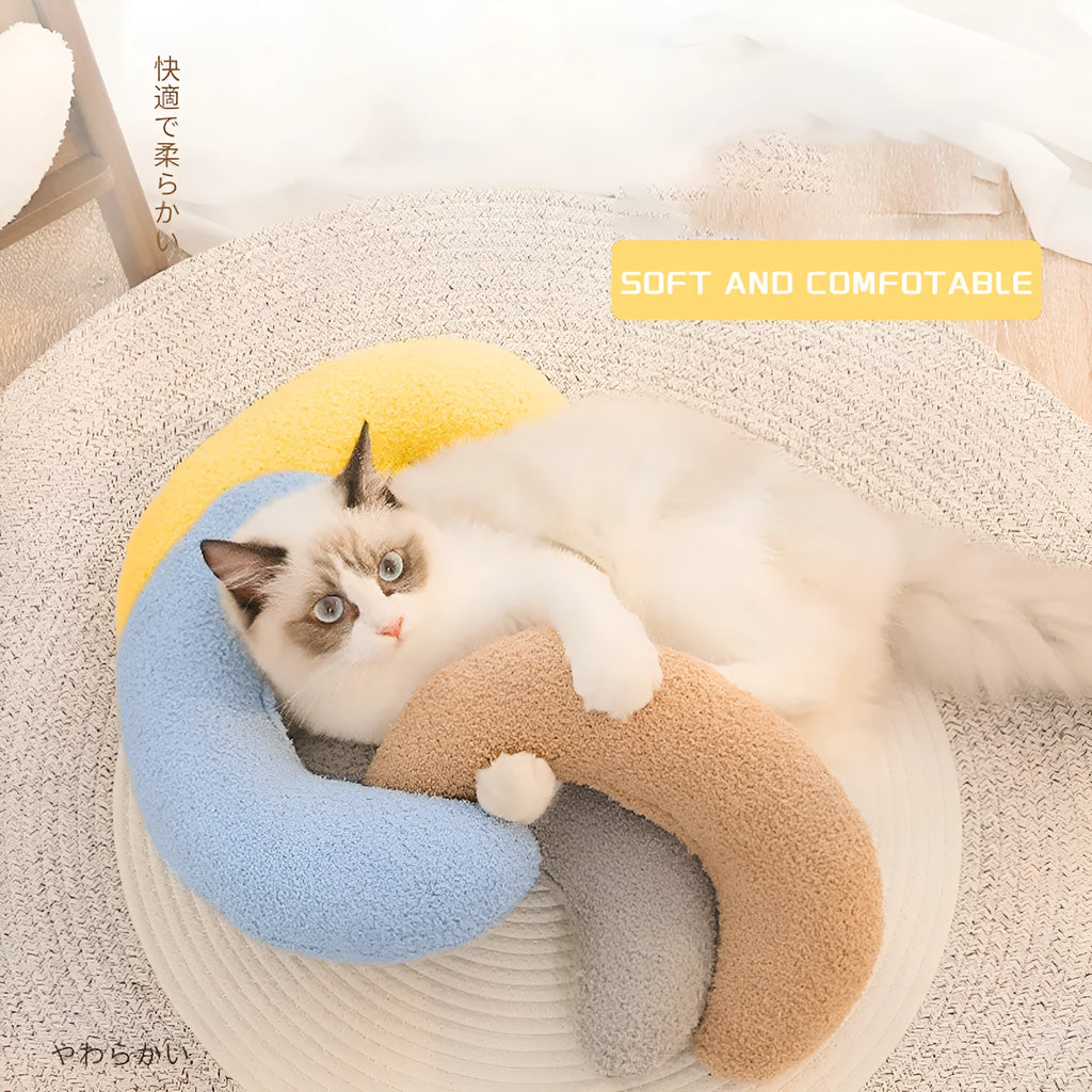 U-shaped blue cat pillow with adjustable neck collar on sofa