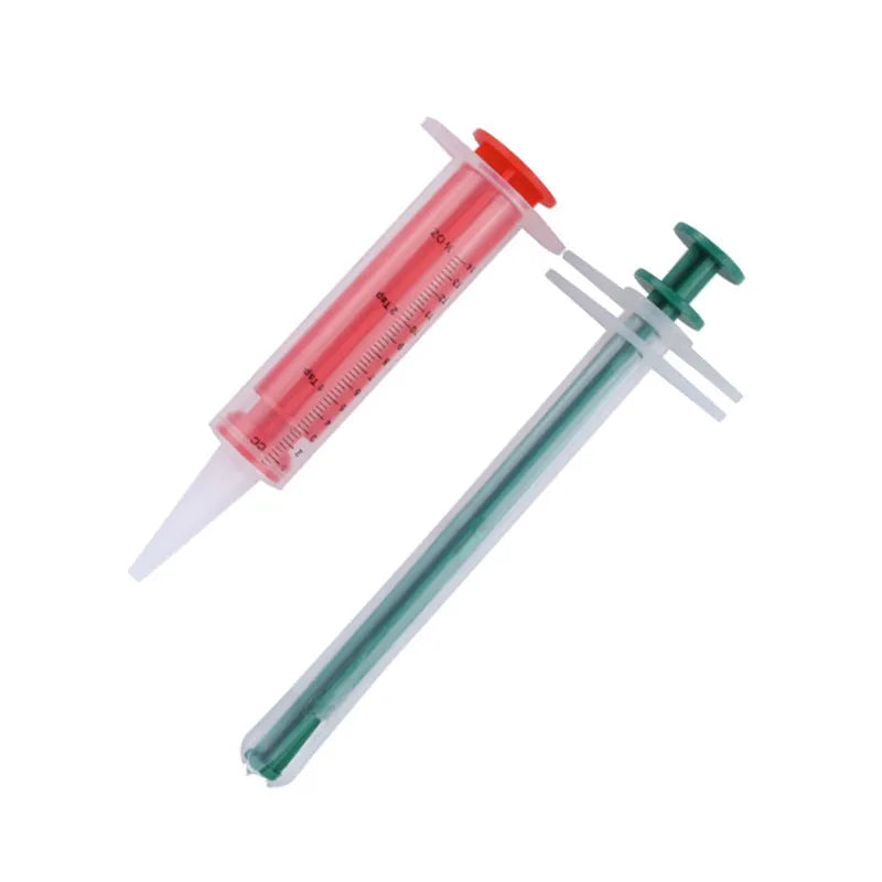 Two pet pill shooters with soft silicone tips in different sizes for cat and dog medication