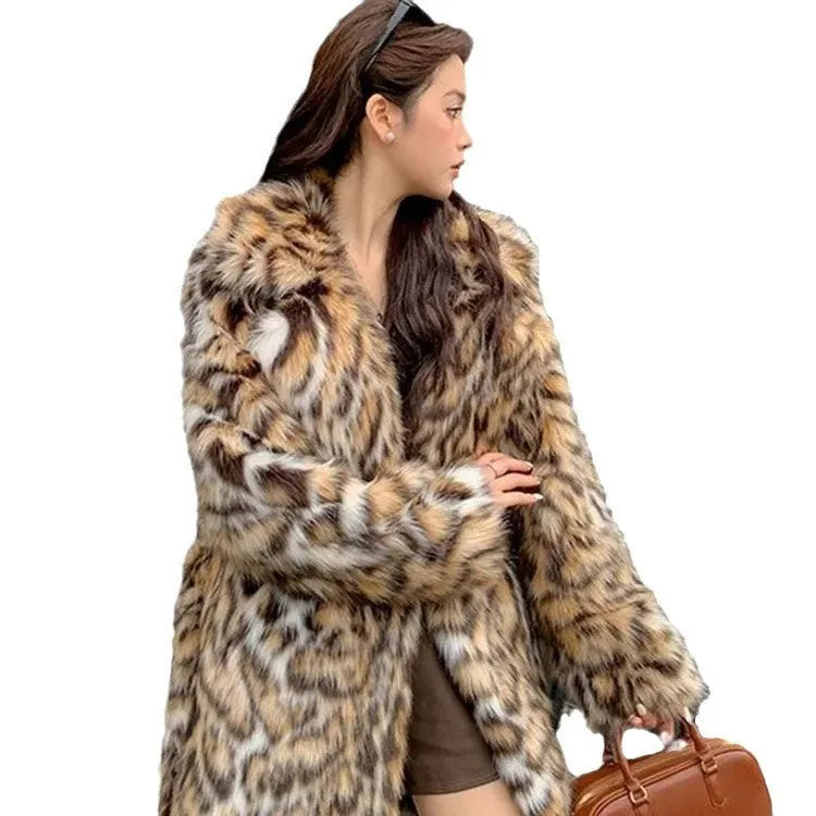 A long faux fur coat with a thick fur collar and pockets, shown in a street-fashion style.