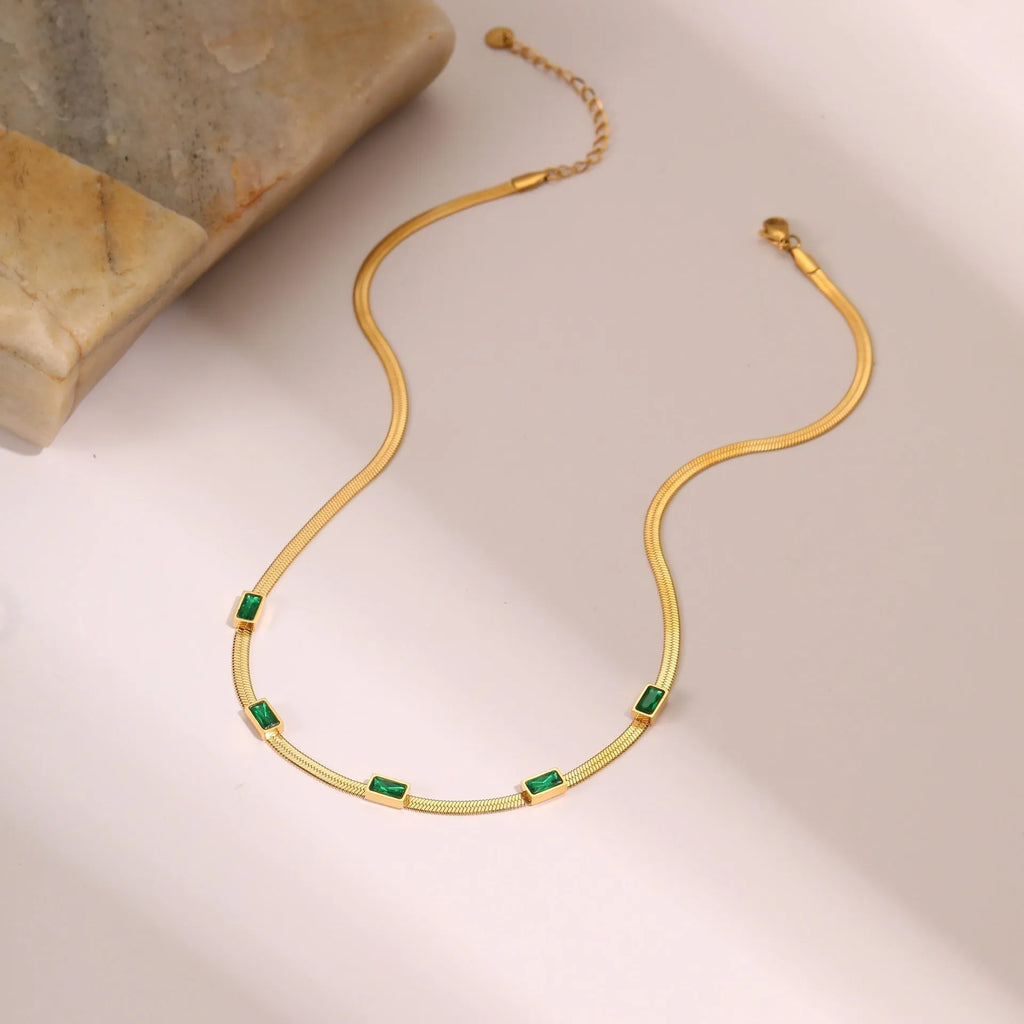 Geometric square pendant zircon necklace on a flat snake chain in gold or steel finish.