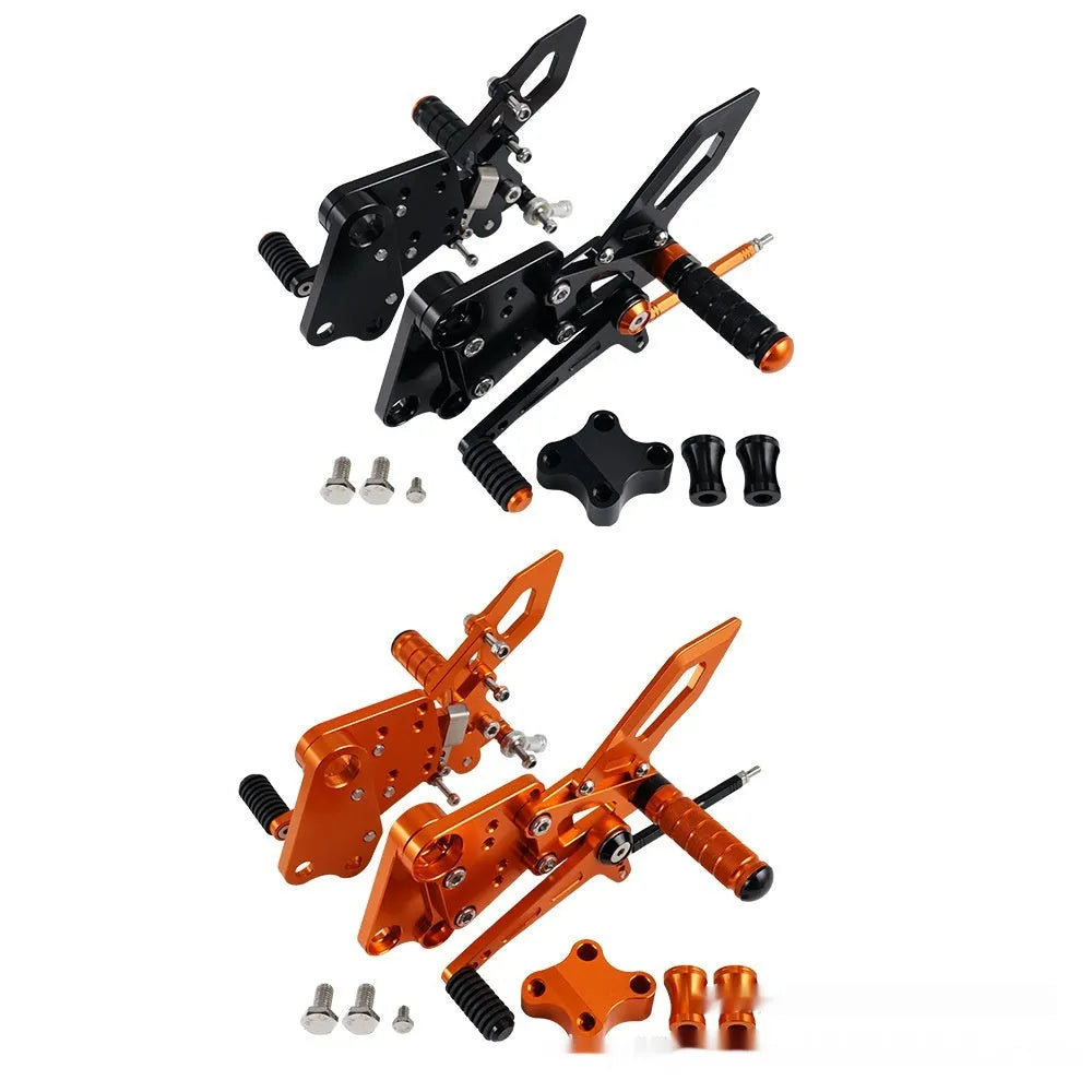 Black and orange KTM Duke motorcycle raised footrest bracket assembly