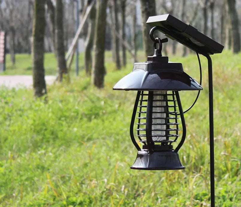 White solar powered mosquito lamp with solar panel and purple/white light switch for outdoor garden insect control
