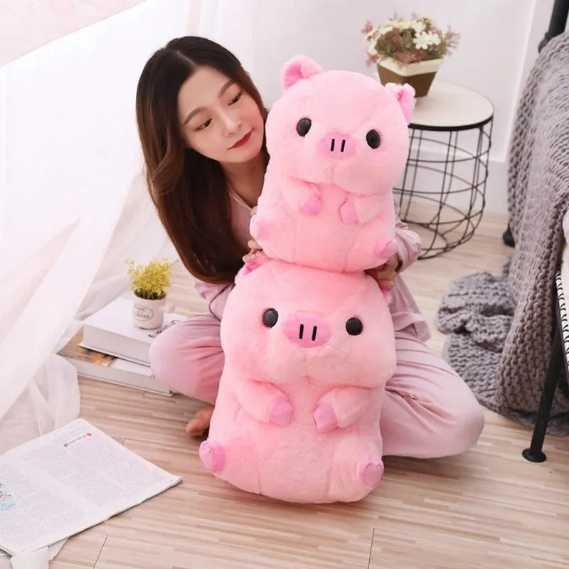 Brown boba milk tea plushie soft toy shaped like a cup with fruit, sitting as a cushion.
