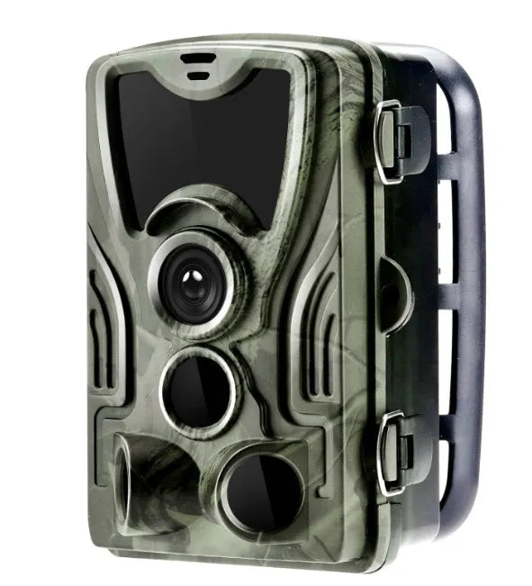 Green cellular trail hunting camera showing front lens and display on a tree mount.