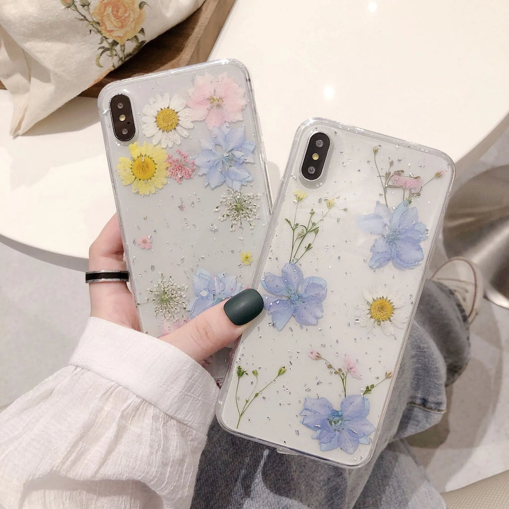 Transparent TPU phone case with real dried daisy flowers and gold glitter under clear epoxy coating