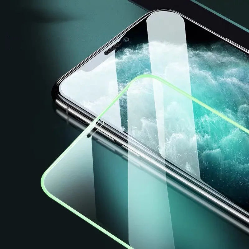 Luminous full cover tempered glass screen protector for iPhone glowing blue in the dark.