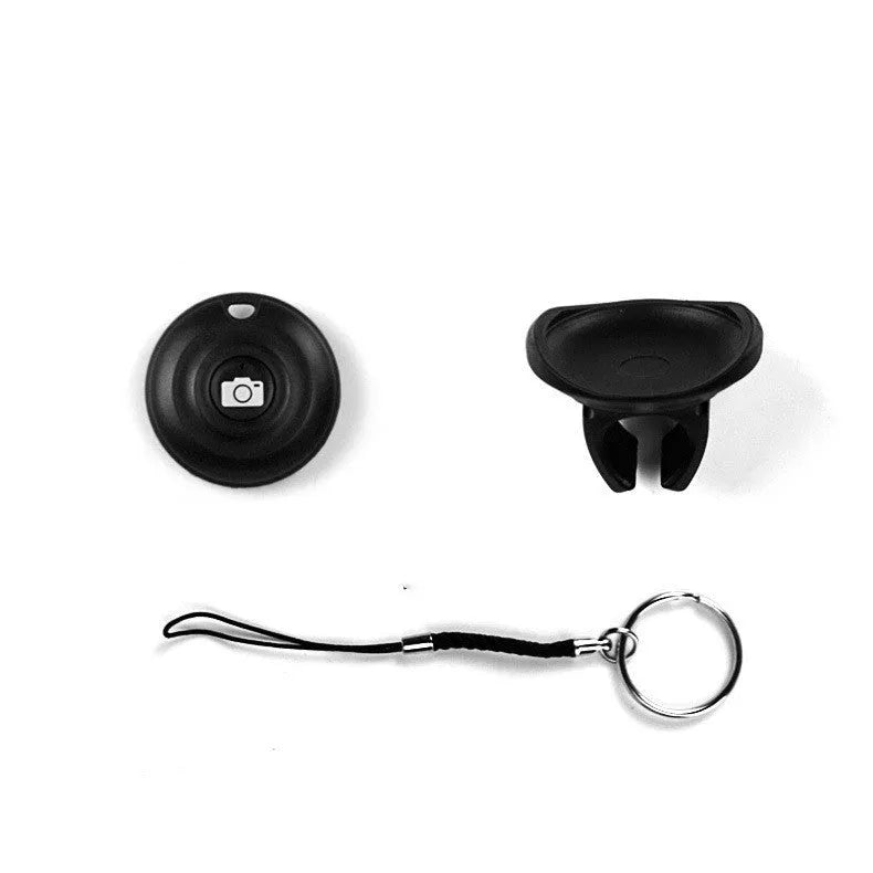 Black Bluetooth remote control for selfies with snap magnetic attachment showing compact design