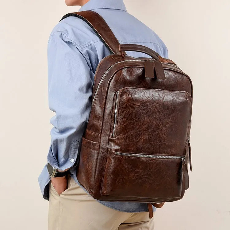 American Vintage large capacity waterproof backpack in solid colour with curved shoulder strap and sewing line detail