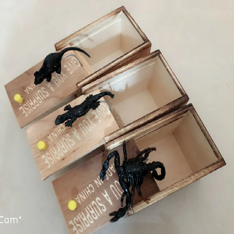 Wooden scare box prank toy with jumping animal surprise for April Fools gags
