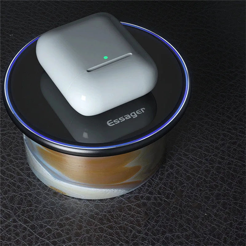 Black aluminium wireless charging pad with LED light and phone positioned for Qi charging