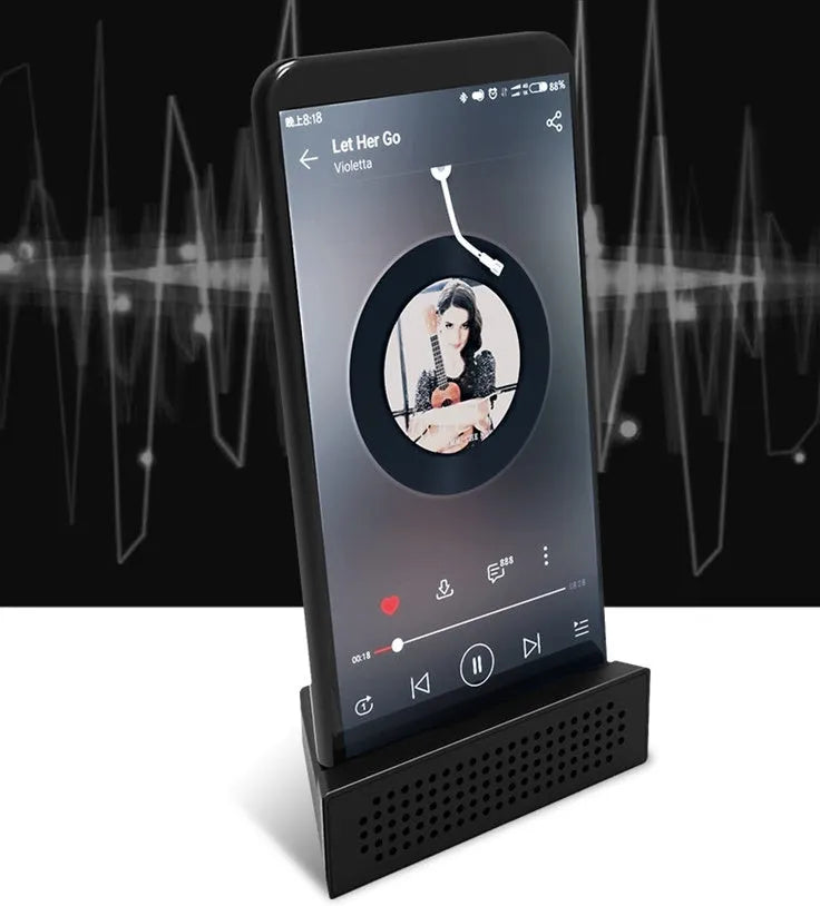 Mini pink phone amplifier holder for iPhone on desktop showing horizontal and vertical positioning