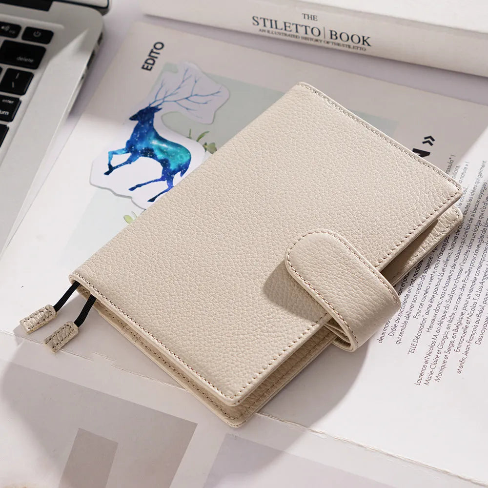 A6 size leather loose-leaf diary with a textured lychee pattern cowhide cover