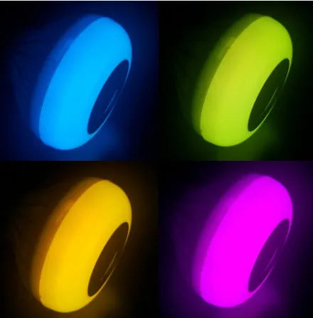 White smart LED bulb with Bluetooth speaker and remote control for colour changing lights.