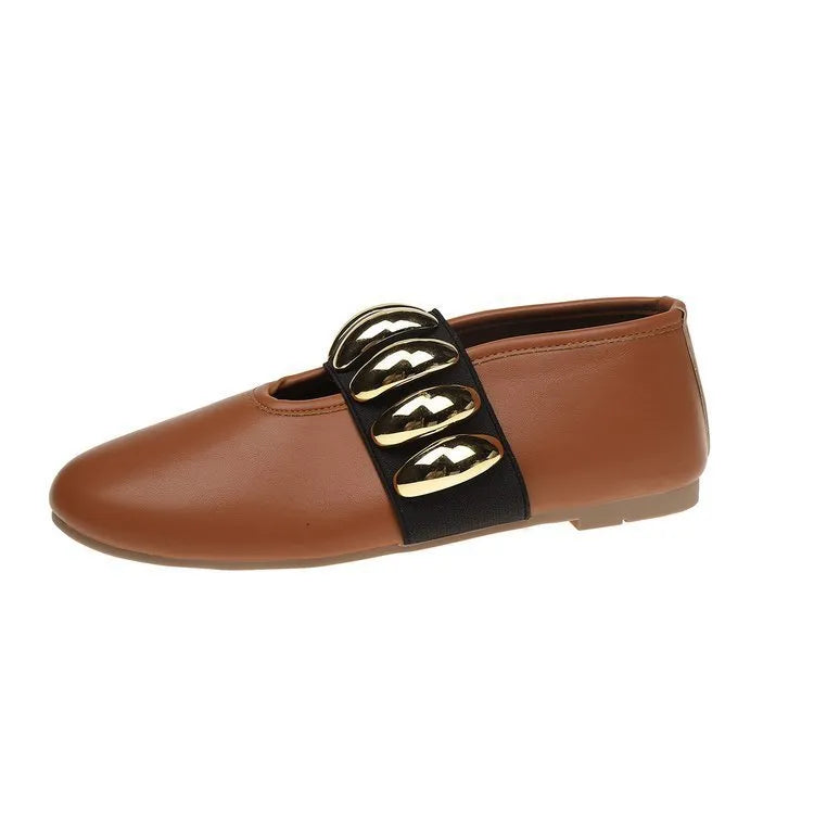 Women's brown flat loafers with metal buckle and round toe on artificial PU upper