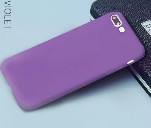Frosted matte soft phone case for Apple iPhone models on a table.